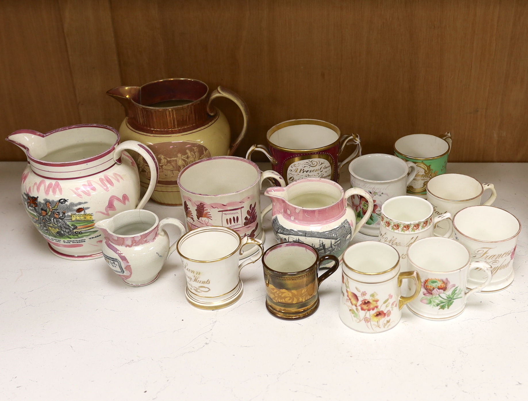 A group of 19th century Staffordshire christening mugs and pink lustre wares